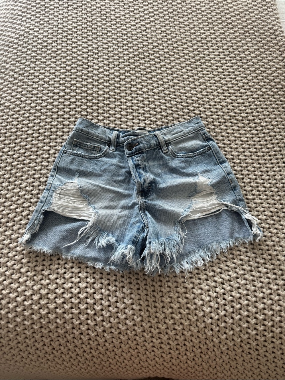 High-Rise Light Blue Distressed Denim Shorts